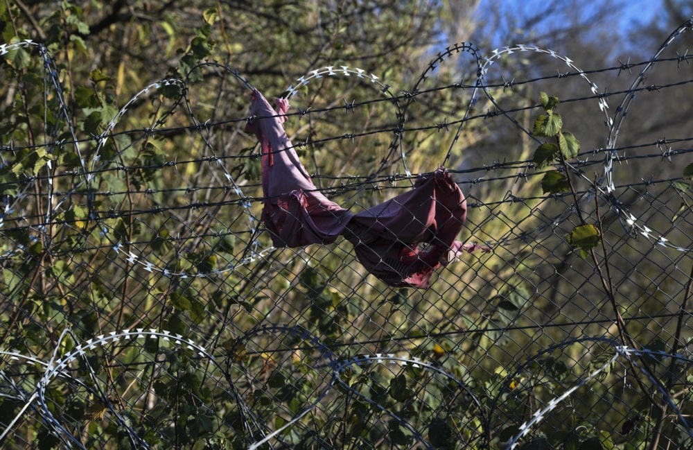 A torn shirt on a barbed-wire fence on the Macedonian-Greek border